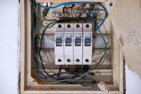 4 Hager C16 Circuit breakers mounted dangerously in a fuse box Stock Photos