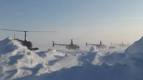 4 helicopters taking off one by one. Russian Ice Camp at the North Pole. Stock Footage 61708733