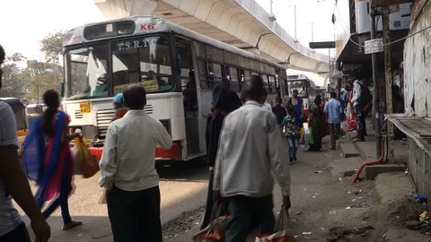4-indian-boarding-bus-at-bus-stop Stock Footage 89389550