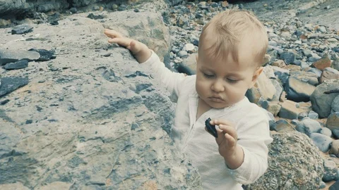 4 k cute brave small boy studying outward things at the vastness nature zone Stock Footage 93568581