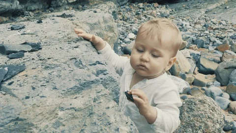 4 k cute brave small boy studying outward things at the vastness nature zone Stock Footage 93568582