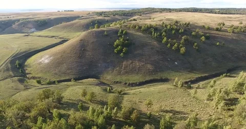 4 k flying over the forest and unusual Hill Stockbeeldmateriaal 73019154