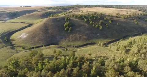 4 k flying over the forest and unusual Hill Stock Footage 73019436