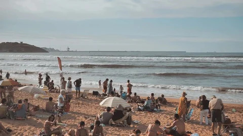 4 k panorama of the summer beach full of people at sunny warm day resting Stock Footage 93214974