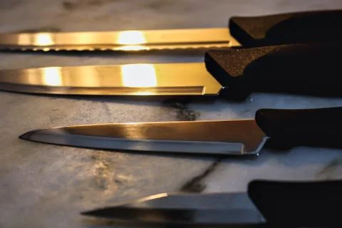 4 knives on a table, .kitchen utensil, chef Stock Photos