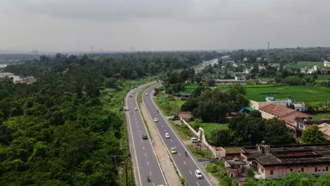 4 lane Highway passing through forest and agricultural land in Uttarakhand,  Stock Footage 161115428