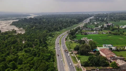 4 lane Highway passing through forest and agricultural land in Uttarakhand,  Stock Footage 161118887