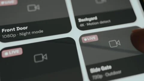 4 live camera feeds for remote monitoring of house on smart home security app Stock Footage 333378797
