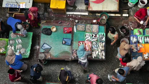4 May 2024, Jakarta-High angle view of fish seller at the fish market. Stock Footage 274701231