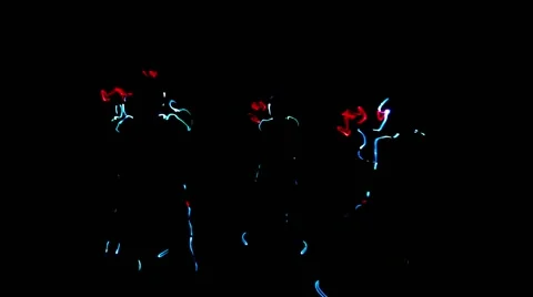 4 people dancing in costumes of LEDs Stock Footage 63175461