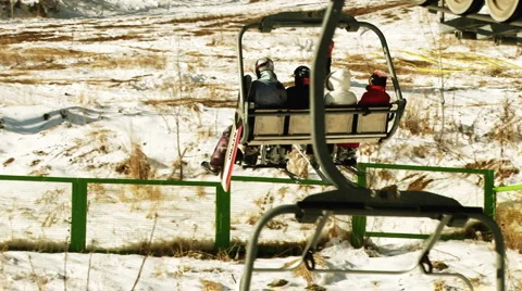 4 Persons On Ski Lift Stock Footage 1042012