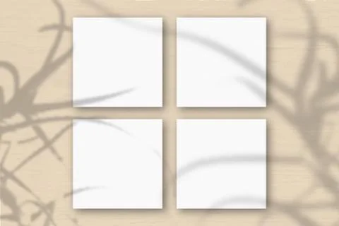 4 square sheets of white textured paper on the orange wall background. Mockup Stock Illustration