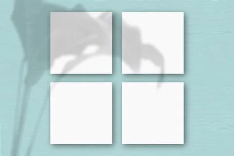 4 square sheets of white textured paper on the blue wall background. Mockup Illustrazione stock