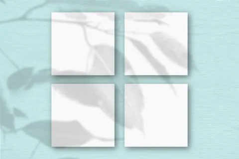 4 square sheets of white textured paper on the blue wall background. Mockup Stock Illustration