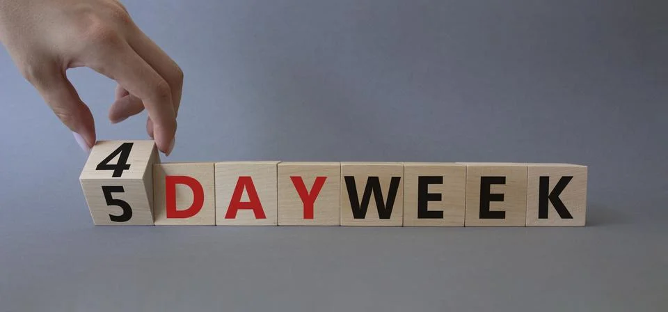 4 vs 5 work week symbol. Businessman hand turns a cube and changes the word.. Stock Photos