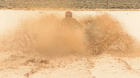 4 Wheel Drive ATV Quad Driving and Splashing Through Mud Bug Stock Footage 107074492