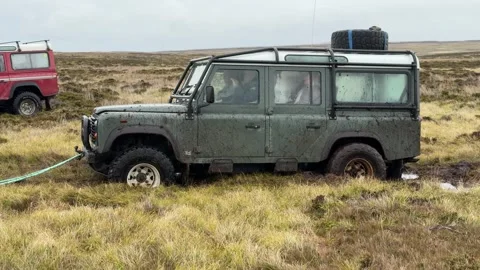 4 Wheel Drive Green Vehicle Stuck in Mud Pulled Out of Ditch. Adventure Tou.. Stock Footage 336926041