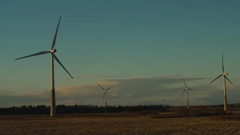 4 wind turbines in the field Stock Footage 309879140