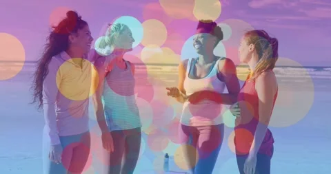 4 women on shore speaker gesturing drawing smiles in fitness chat bokeh avoiding Stock Footage 331429519