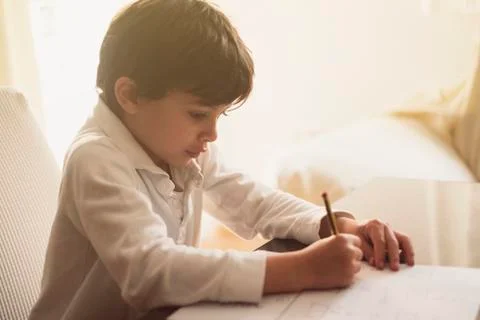 4-year-old boy does homework at home. Stock-Fotos