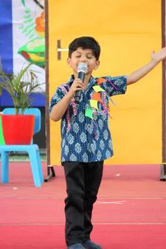 4 year old boy is performing a skit on stage. Representing Indian culture and ki Stock Photos
