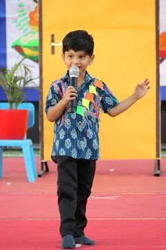 4 year old boy is performing a skit on stage. Representing Indian culture and ki Stock Photos