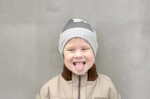 A 4-year-old boy shows his tongue. The child smiles and shows tongue Stock Photos