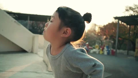 4-year-old kid playing outside in the evening of holiday Video stock 161858446