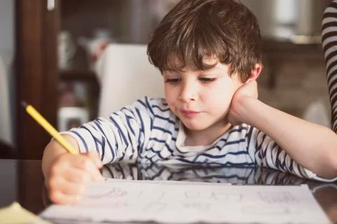 4 years old doing homework at home Stock Photos
