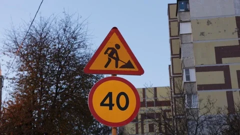 40 km / h speed limit sign and road repair work. Signs on a yellow background. T Stock Footage 119916015