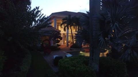 40 St Thomas dolly in crane down backyard view night shot. Video stock 55289265