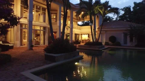 40 St Thomas dolly over pool through trees with view of the backyard Video stock 55288989