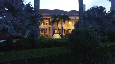 40 St Thomas low altitude fly over plants backyard night shot. Stock Footage 55289300