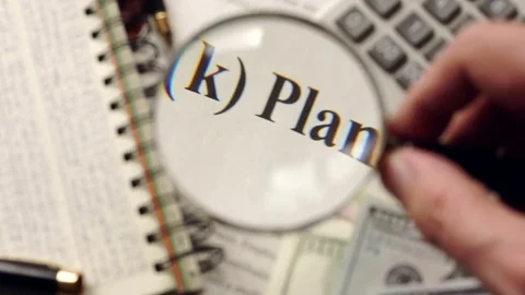 401k plan is watched with magnifier. Retirement concept. Stock Footage 73233029