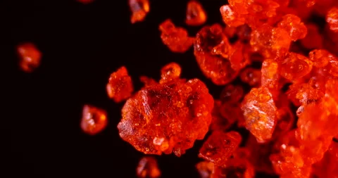 40x Microscopic View of Moving Ammonium Dichromate Particles Video stock 303630563