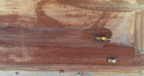 414 Heavy construction equipment compacting soil on runway construction site Video stock 88925277