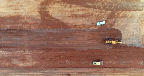 415 Heavy construction equipment compacting soil on  runway construction sit3 Stock Footage 88925079