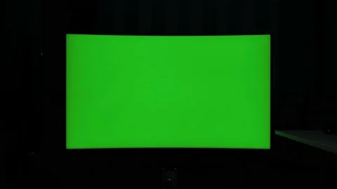 422 10 bit static shot, curved tv green screen at night in a dark room Stock Footage 231415360