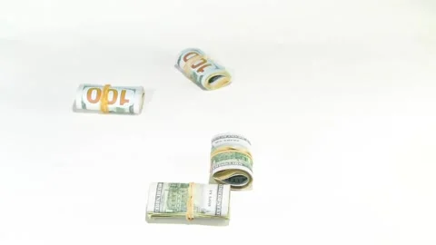 433 Hundred dollar bills wrapped in rubber bands in circles falling from the sky Stock-Footage 131740955