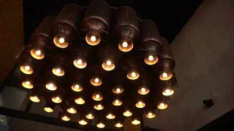 4/4 Incandescent Lamp Lights Flickers on Black Background Stock Footage 234430686
