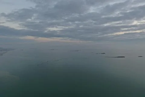 A 44-meter drone perspective reveals fish-trap net lines threading across the Stock Photos