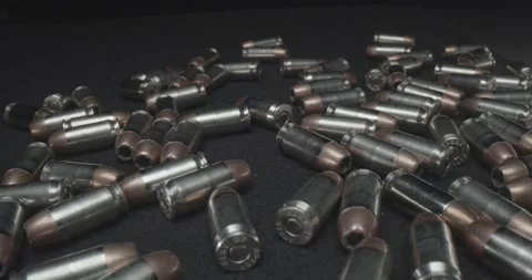 45 caliber ammo spread out on table Video stock 141005461