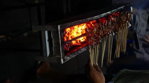 45 Degree view. The process of grilling Indonesian chicken satay in traditi.. Stock-Footage 294276063
