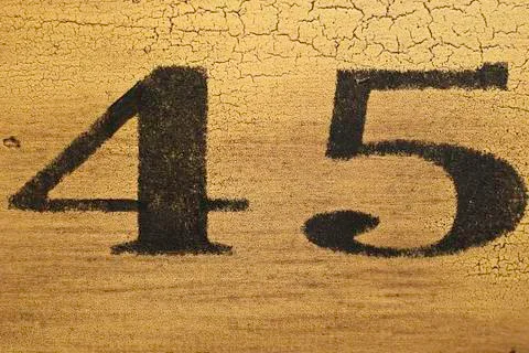 45 printed on yellow surface Stock Photos