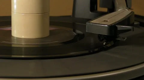 45 single record spinning around on 1960s turntable Stock Footage 5503614
