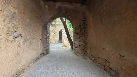 47 Stone archway passage through mud wall to ancient village courtyard Stock Footage 345884923