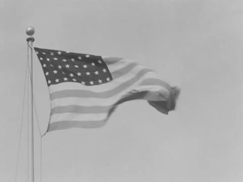 48-star flag hoisted on flagpole Stock Footage 158250773