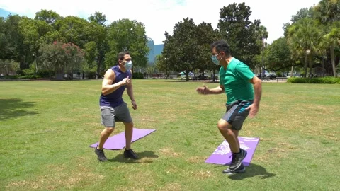 480 Two workout partners and one encouraging the other one during Covid19 Stock Footage 133521918