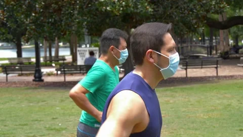 482 Side shot of two people going for a jog during covid19 pandemic 動画素材 133521949