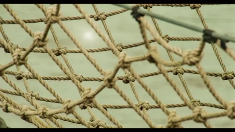 48608 Intricate Knot Design on a Climbing Net Showcasing Craftsmanship and .. Stock Footage 304168353